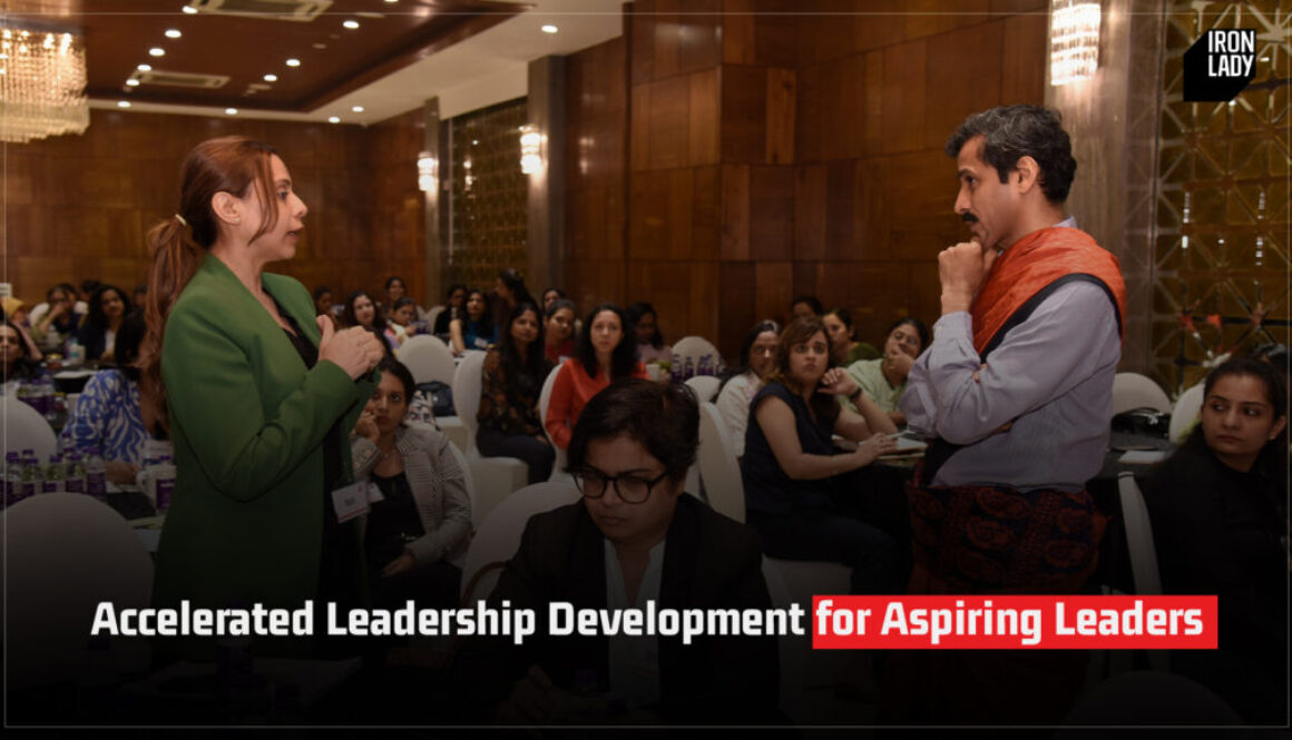 A leadership development workshop in progress, featuring a female speaker addressing a room full of aspiring leaders, with an attentive audience in a professional setting.
